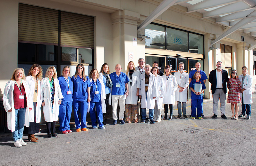 Research staff and pain professionals in front of the general hospital